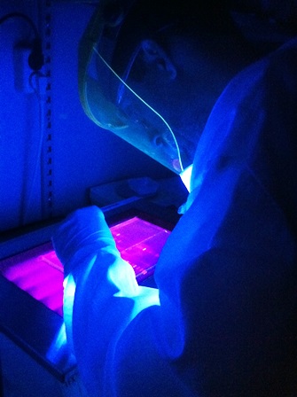 researcher working in lab with protective gear